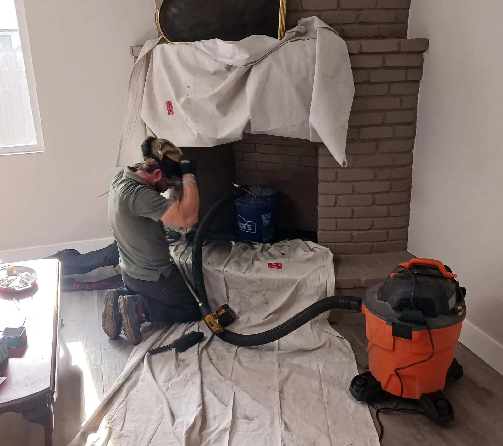 The hearth sheeted off and a HEPA vacuum running before the brushes come out
