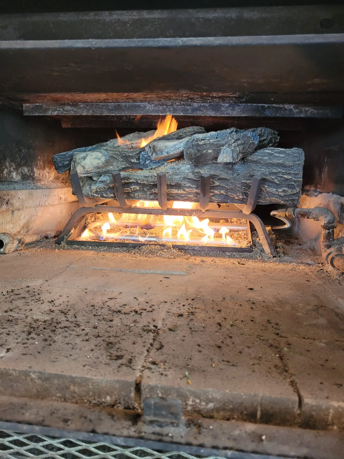 A gas log set burning evenly after a service