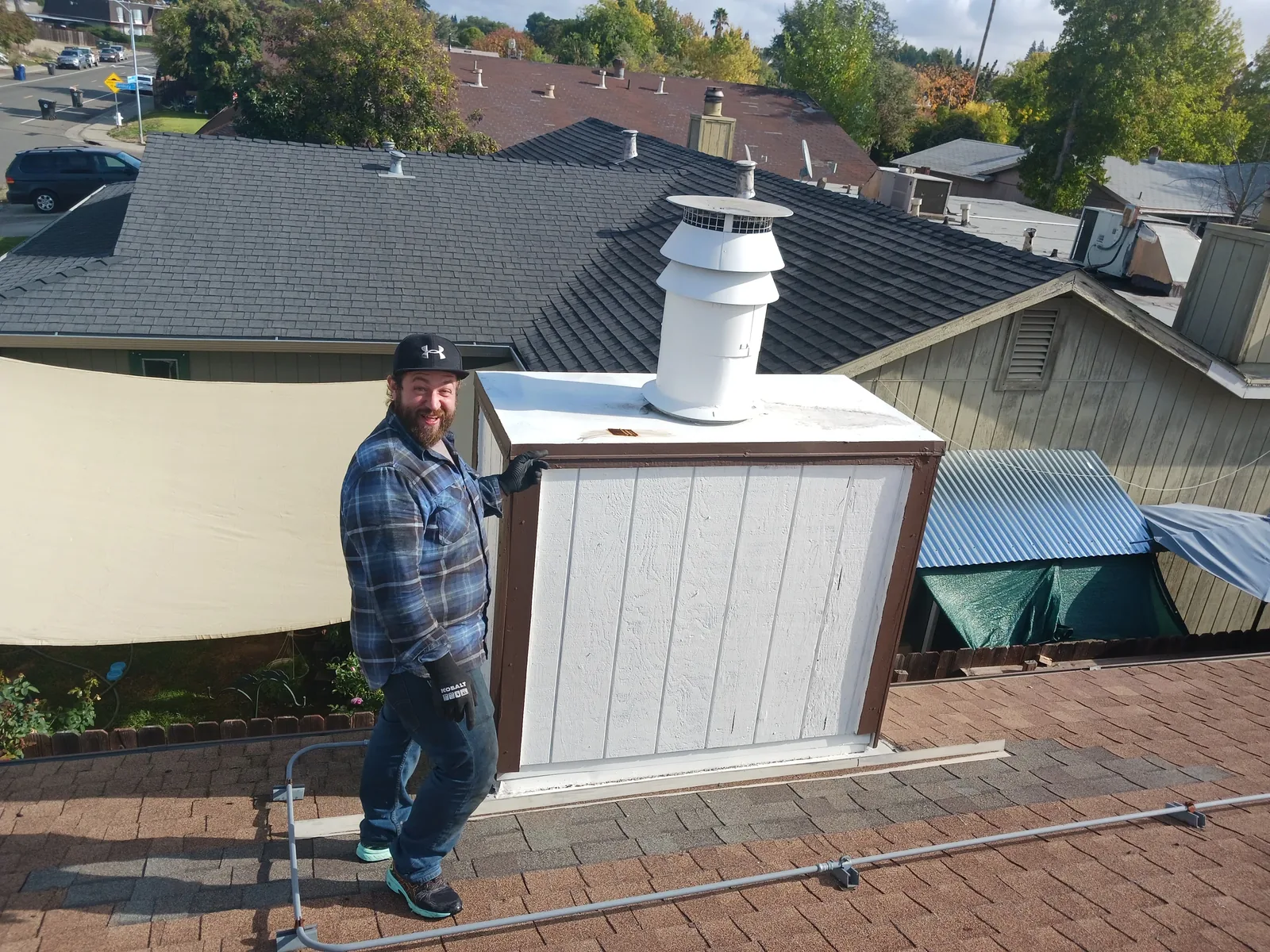 On the roof beside a framed and stuccoed chase before the winter winds